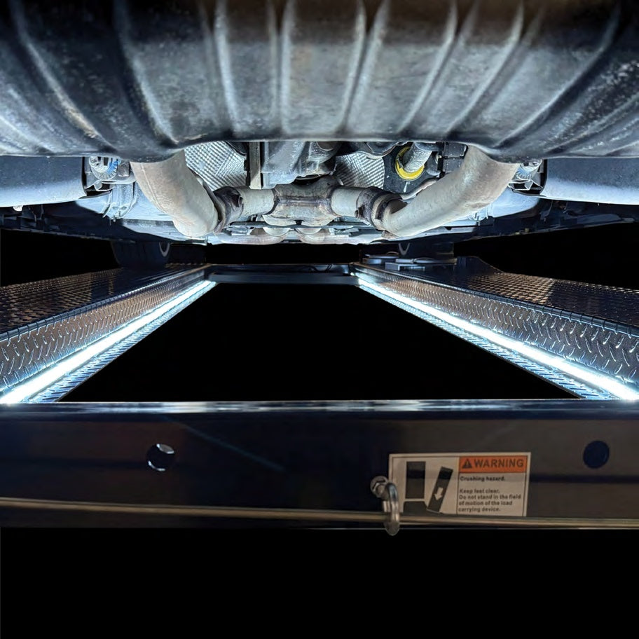 Atlas magnetic LED lift lights illuminating both runways under a vehicle on a 4-post lift